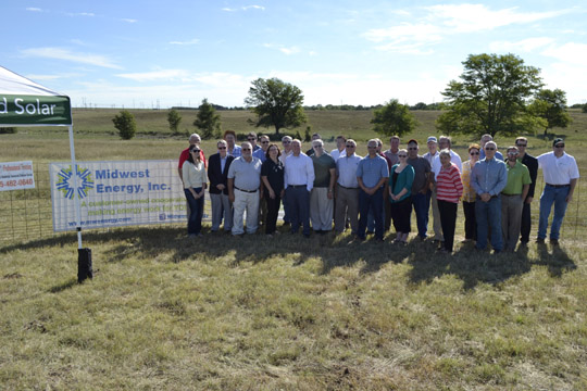 The group gathers in front of what in a few weeks will be transformed into Kansas' largest solar array!