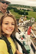 Kirsten Zerr, a senior at Wheatland High School, takes a ride in a bucket lift with a lineman from Kaw Valley Electric Cooperative outside of Topeka on June 19.