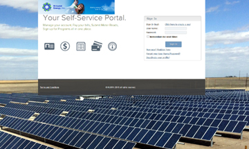 A screen shot of the new self-service portal page is overlaid on a photo of the 3,960 solar panels at the Midwest Energy Community Solar Array in Colby, Kan.