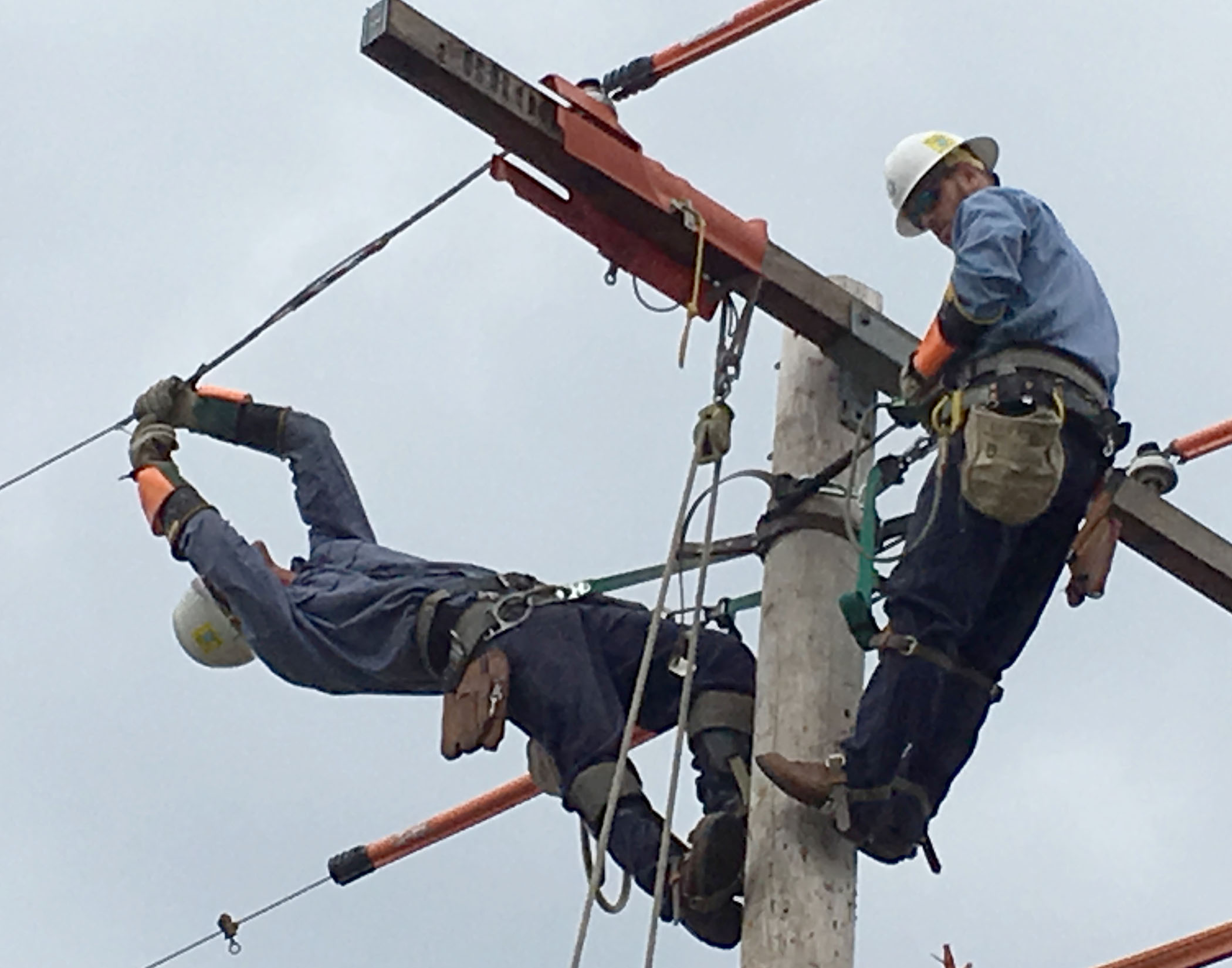 A photo of Great Bend Journeyman team members Alex Breeding and Nathan Stryker work on replacing a wire tie at the International Lineman’s Rodeo in Bonner Springs, Oct. 14.