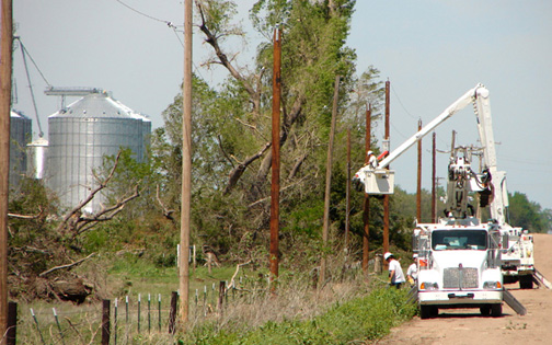 Midwest Energy crews replace poles near Rush Center that were damaged during a tornado April 14. A total of 526 poles and 24 miles of line were replaced as a result of the storm which produced 121 tornadoes throughout Kansas, Nebraska, Iowa, Oklahoma and Texas. No fatalities were reported in Kansas, though six were killed in Woodward, Okla.